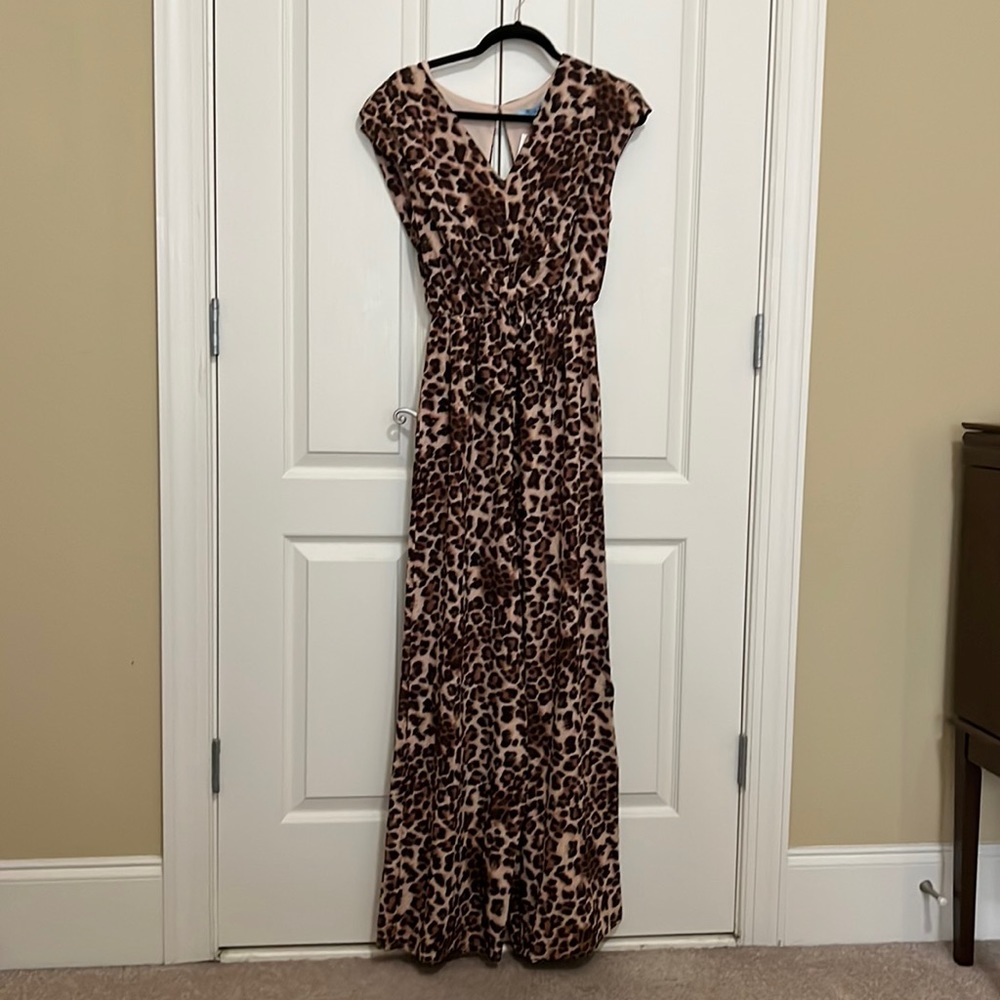 A brand new She + Sky leopard jumpsuit. It has a v-neck front and an open back.